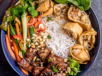 Vermicelli noodles with grilled pork and egg roll